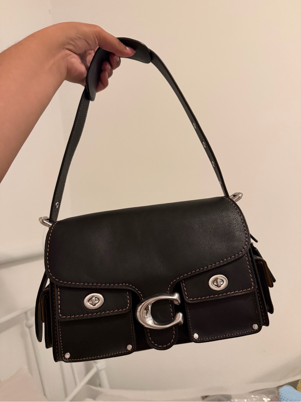 Coach cargo western turn lock soft tabby.